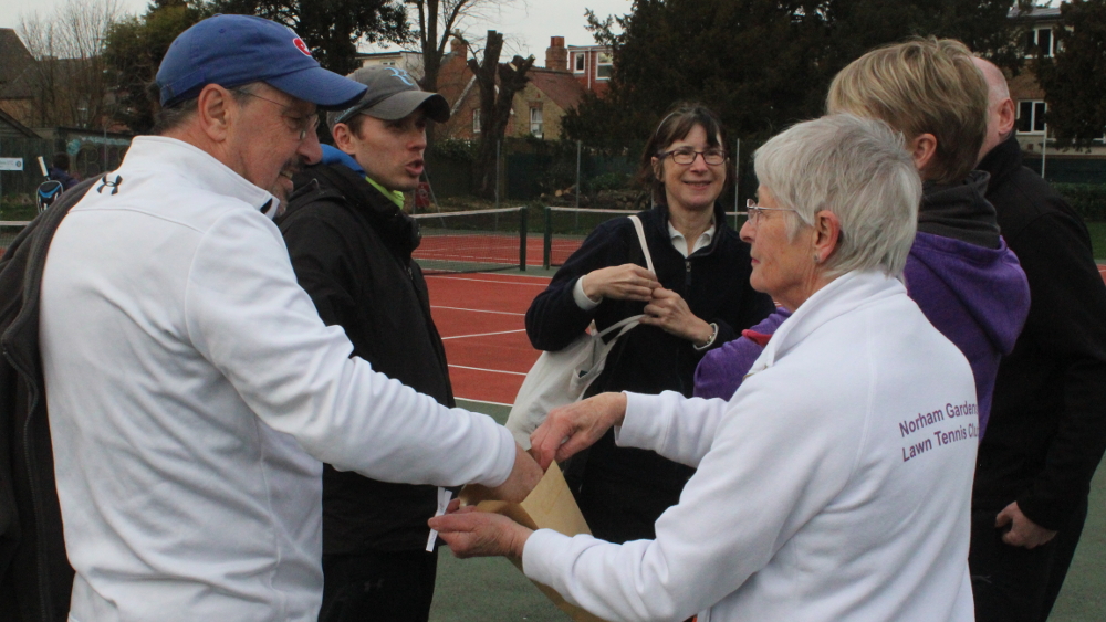 Members took it turn to draw from the envelope. Erdem Idiz tries to feel for his name.